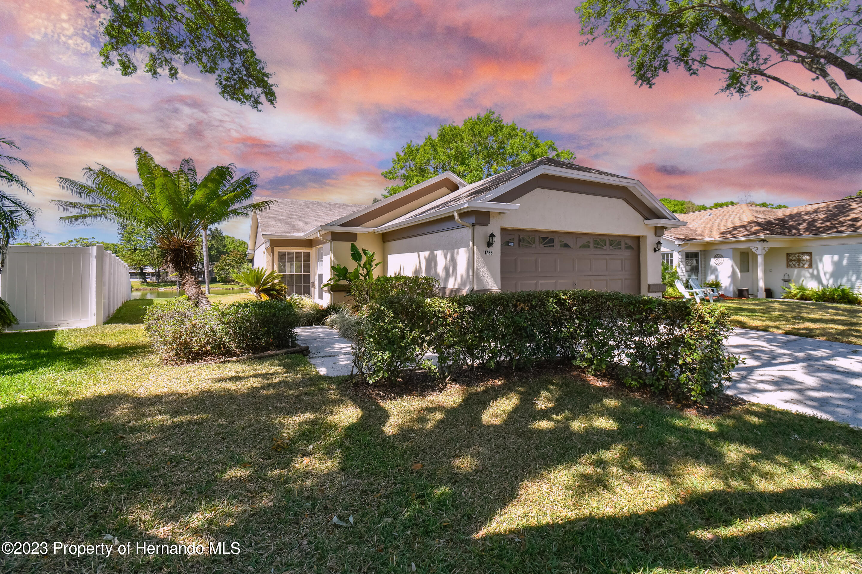 1735 Elk Spring Drive Brandon, FL 33511 - Photo 1 of 49 a front view of a house with a yard