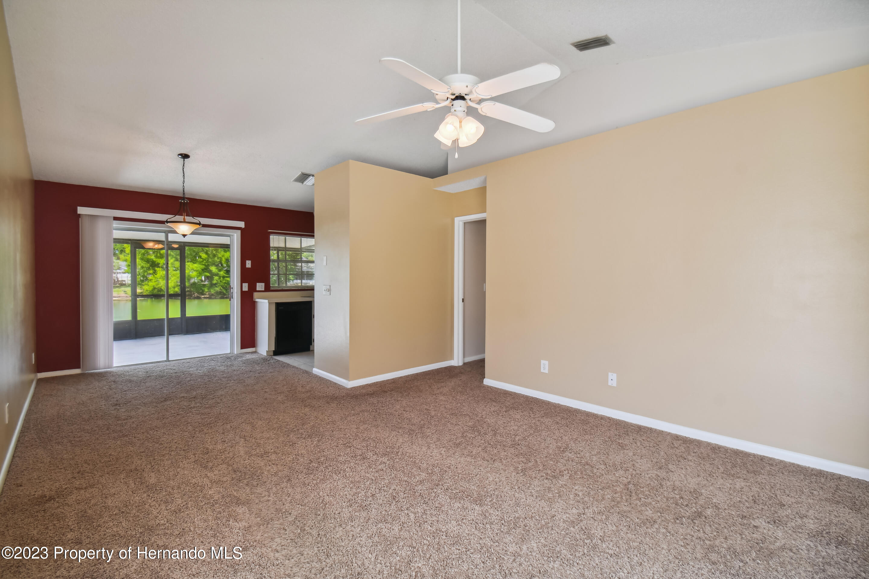 1735 Elk Spring Drive Brandon, FL 33511 - Photo 14 of 49 an empty room with windows and fan