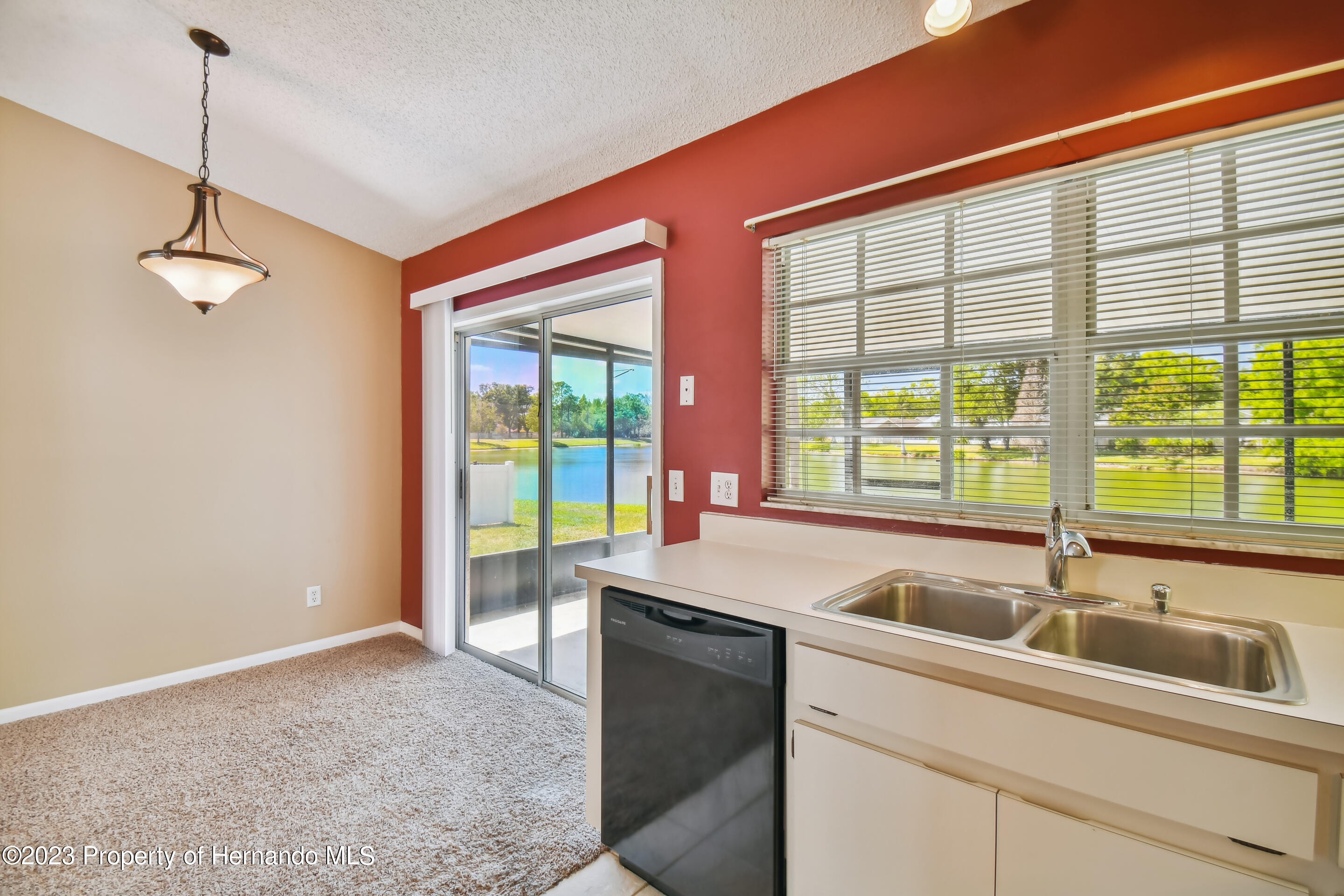 1735 Elk Spring Drive Brandon, FL 33511 - Photo 19 of 49 a kitchen with a sink and large window
