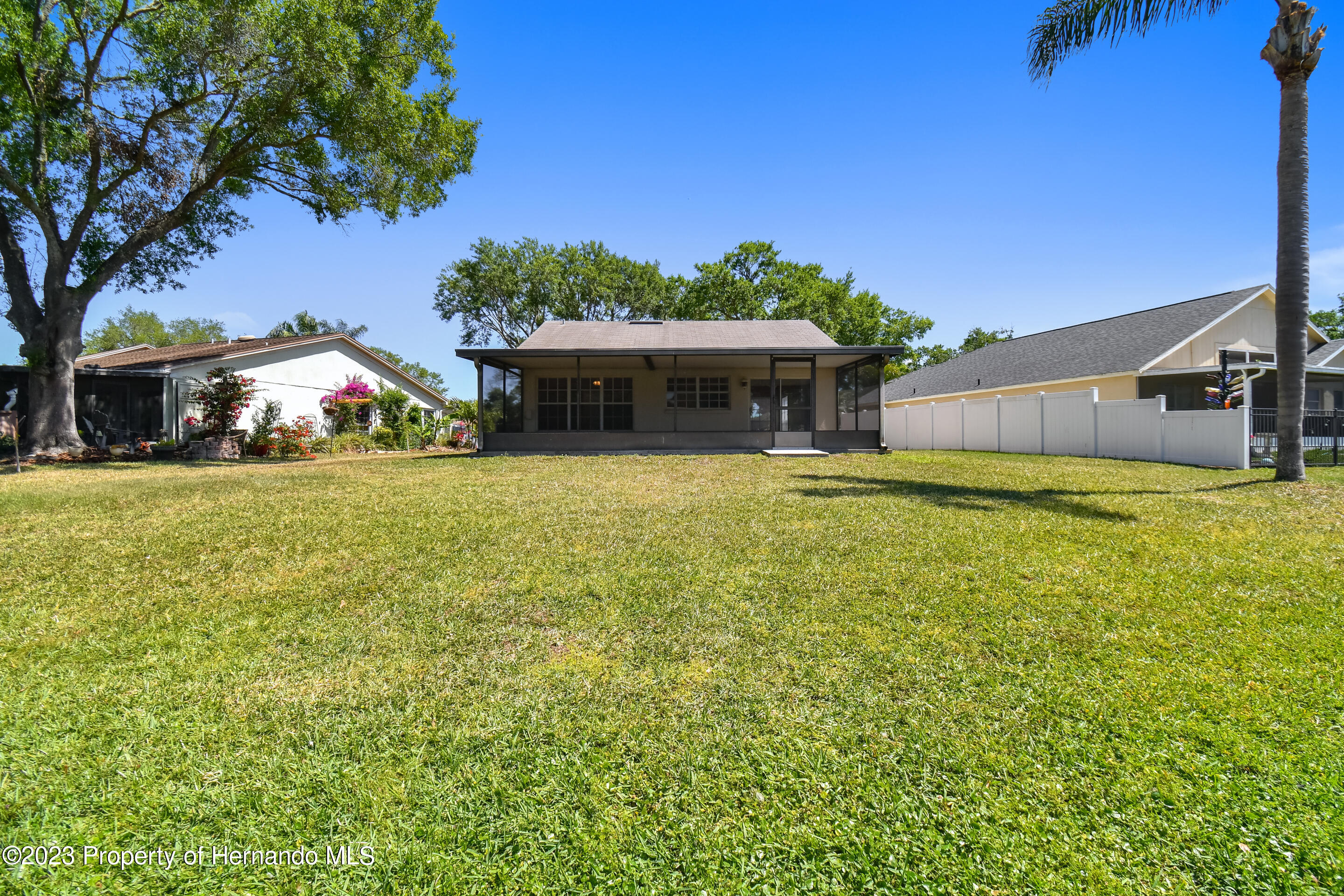 1735 Elk Spring Drive Brandon, FL 33511 - Photo 32 of 49 a view of a house with swimming pool and porch