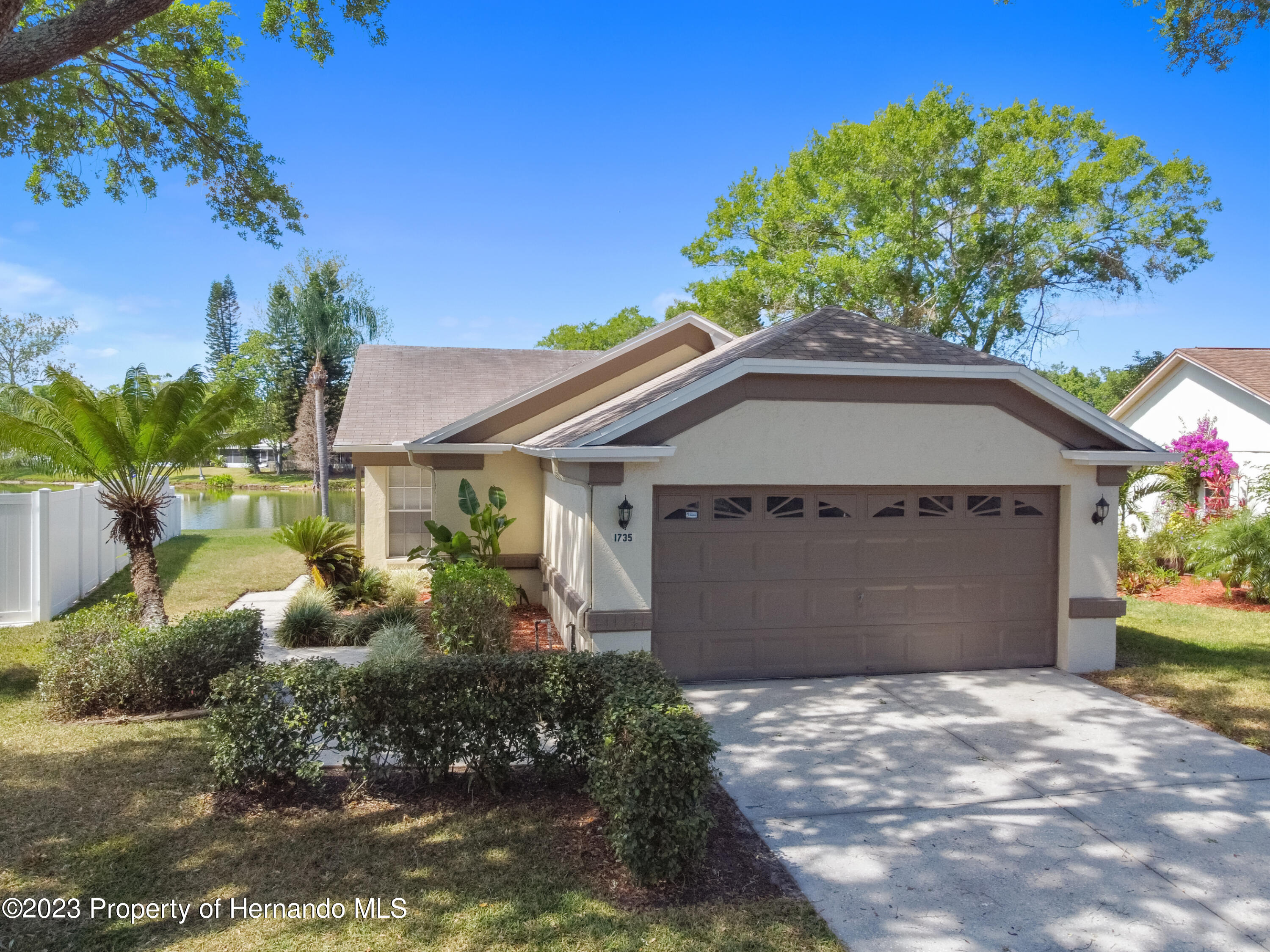 1735 Elk Spring Drive Brandon, FL 33511 - Photo 37 of 49 a front view of a house with garden