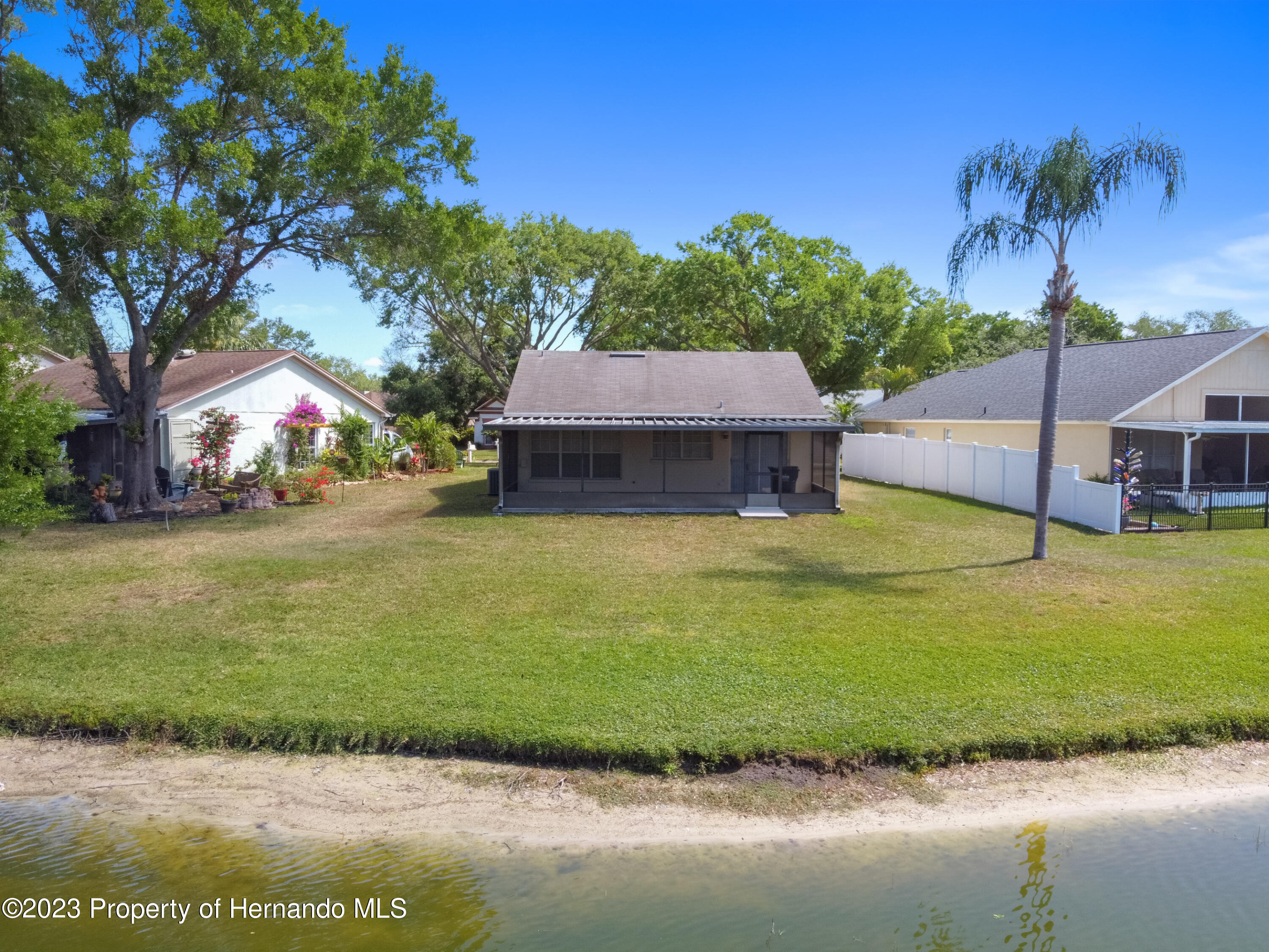 1735 Elk Spring Drive Brandon, FL 33511 - Photo 38 of 49 a view of a house with swimming pool and a yard
