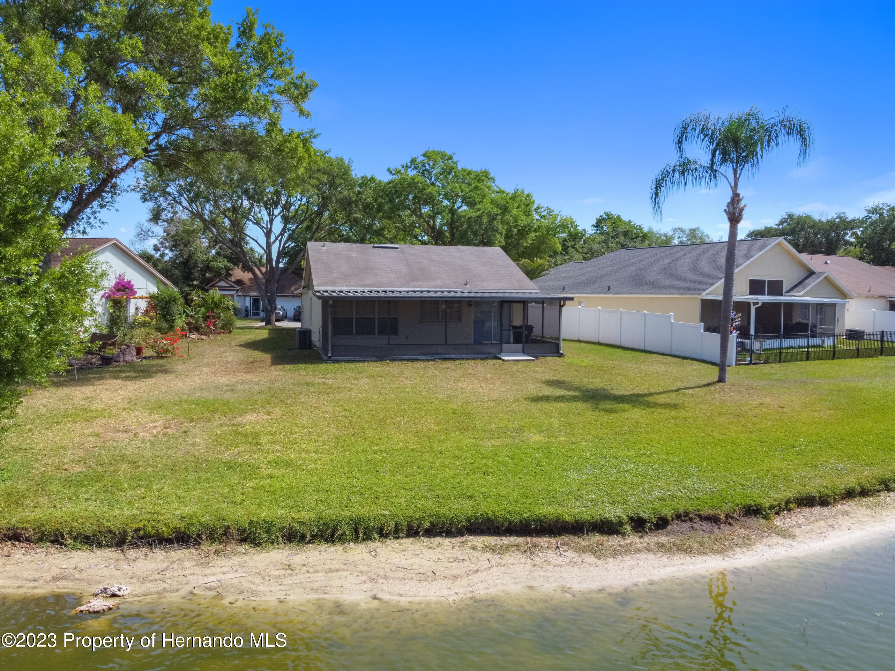 1735 Elk Spring Drive Brandon, FL 33511 - Photo 40 of 49 a view of a house with swimming pool and a yard