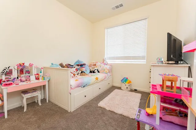 a bedroom with furniture and a bed