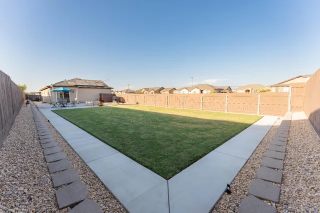 an aerial view of a house with a garden