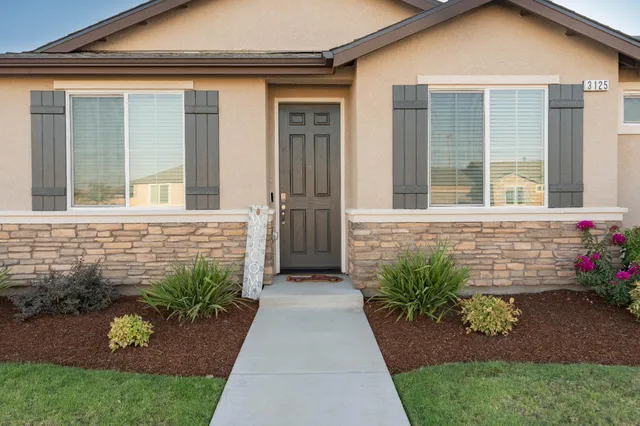 front view of a house with a yard