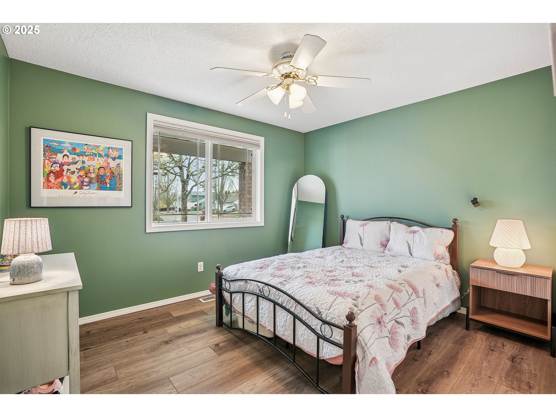 591 Southwest Filbert Street McMinnville, OR 97128 - Photo 18 of 34 a bedroom with a bed and a chandelier