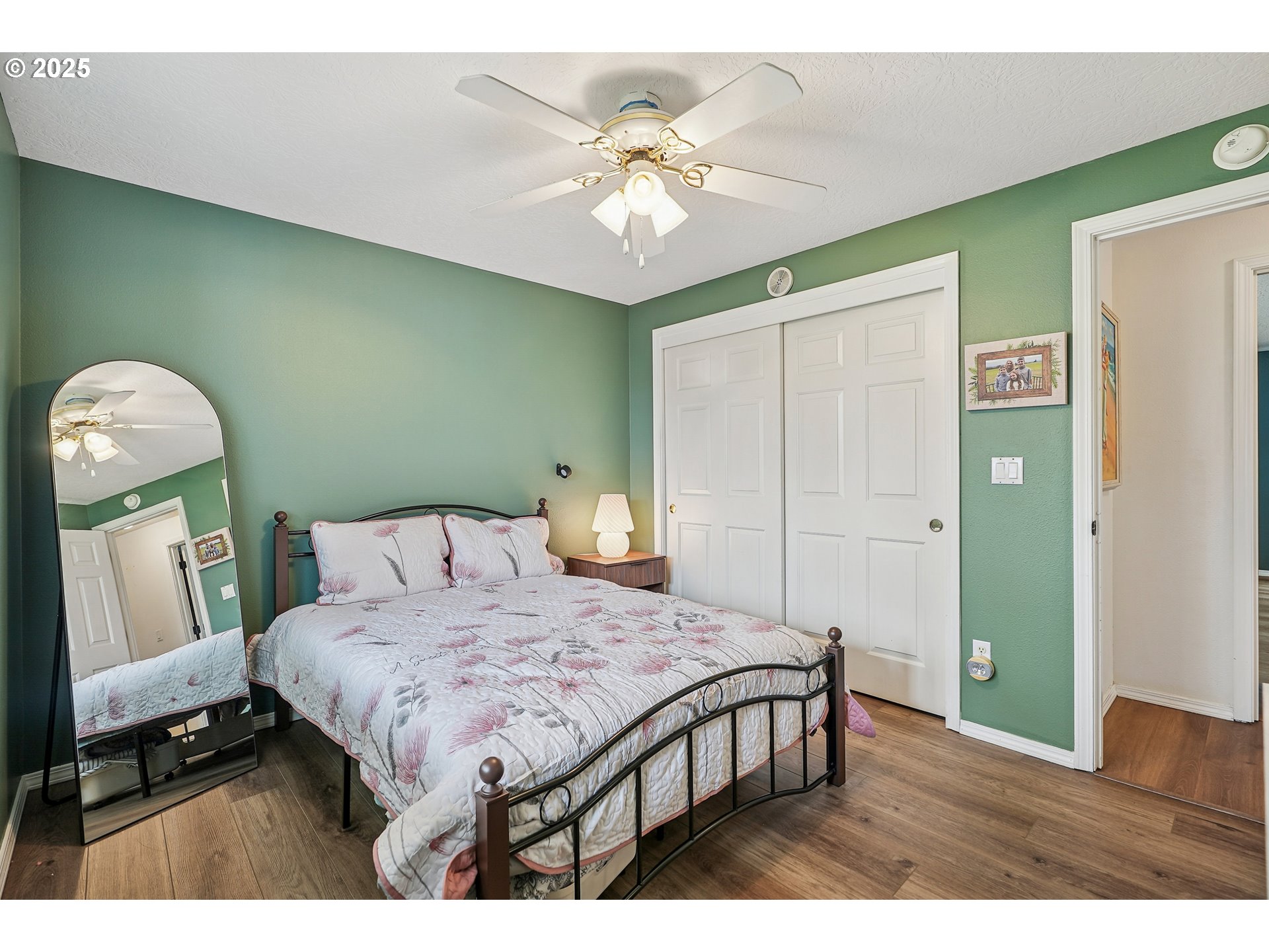 591 Southwest Filbert Street McMinnville, OR 97128 - Photo 19 of 34 a bedroom with a bed and a chandelier