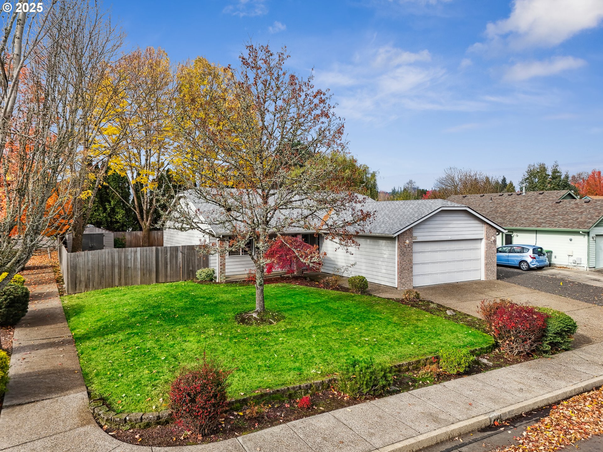 591 Southwest Filbert Street McMinnville, OR 97128 - Photo 2 of 34 a view of a backyard with a garden and plants