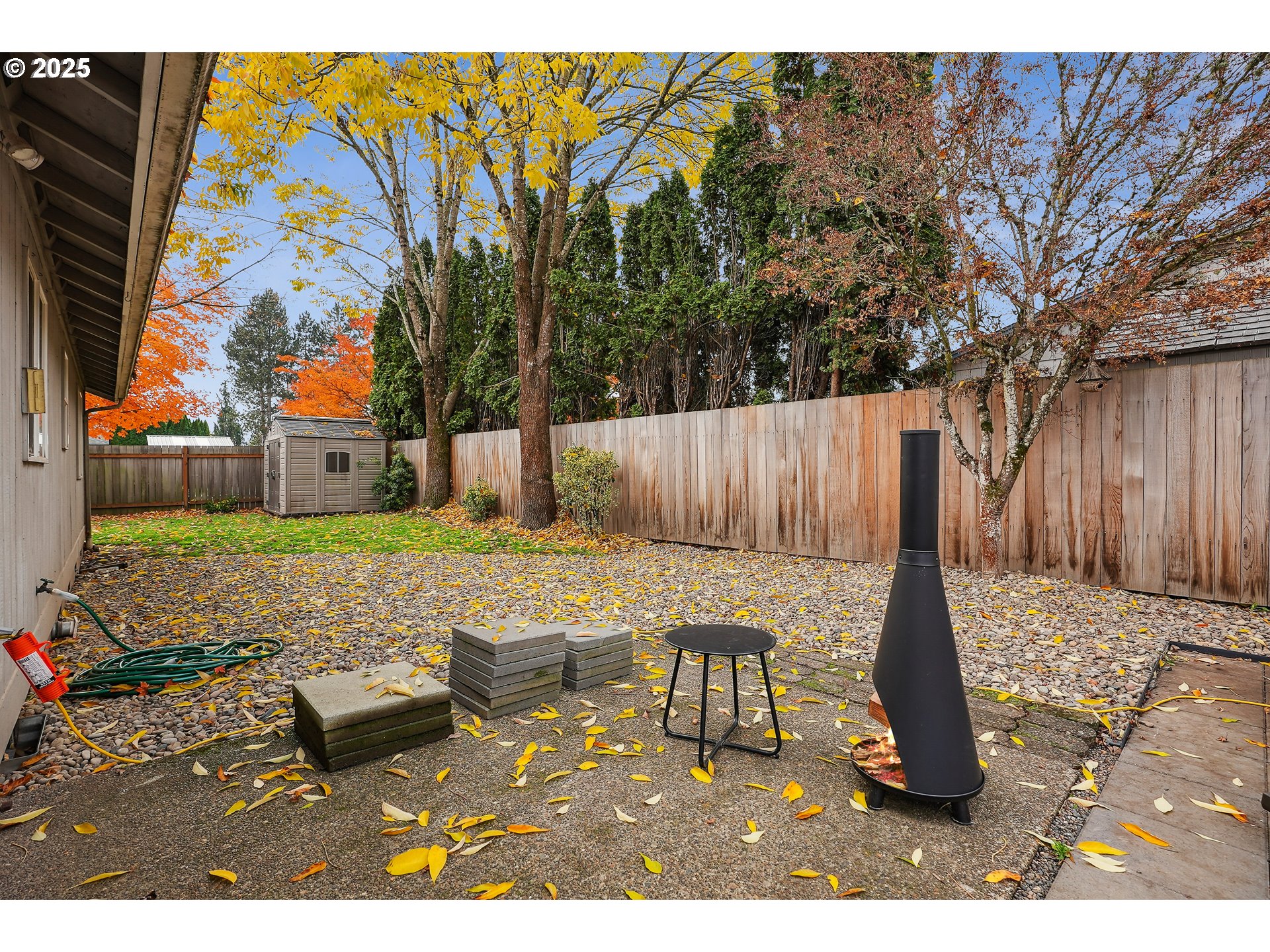 591 Southwest Filbert Street McMinnville, OR 97128 - Photo 24 of 34 a view of a backyard with table and chairs with wooden fence