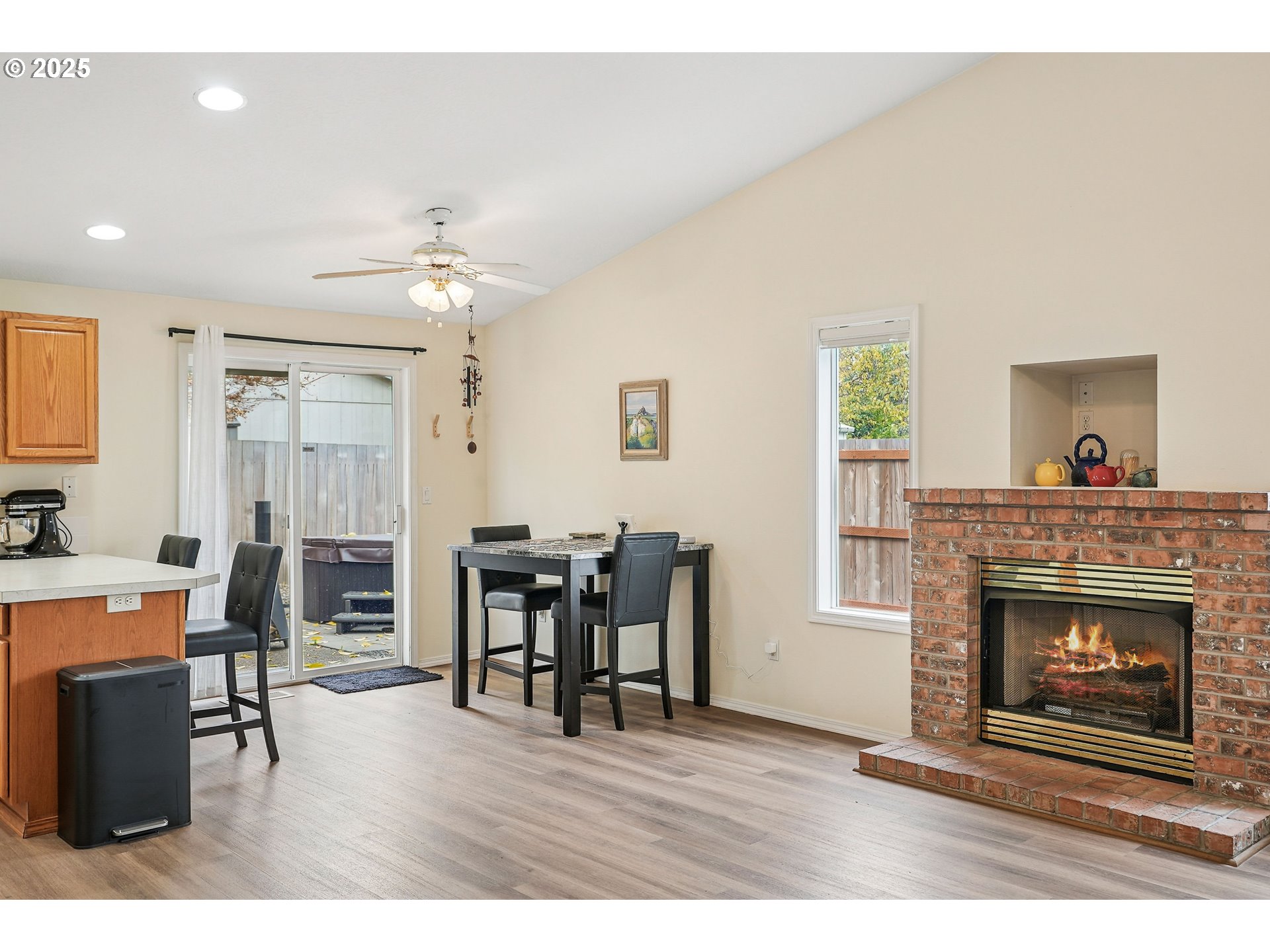 591 Southwest Filbert Street McMinnville, OR 97128 - Photo 9 of 34 a living room with furniture a fireplace and a table