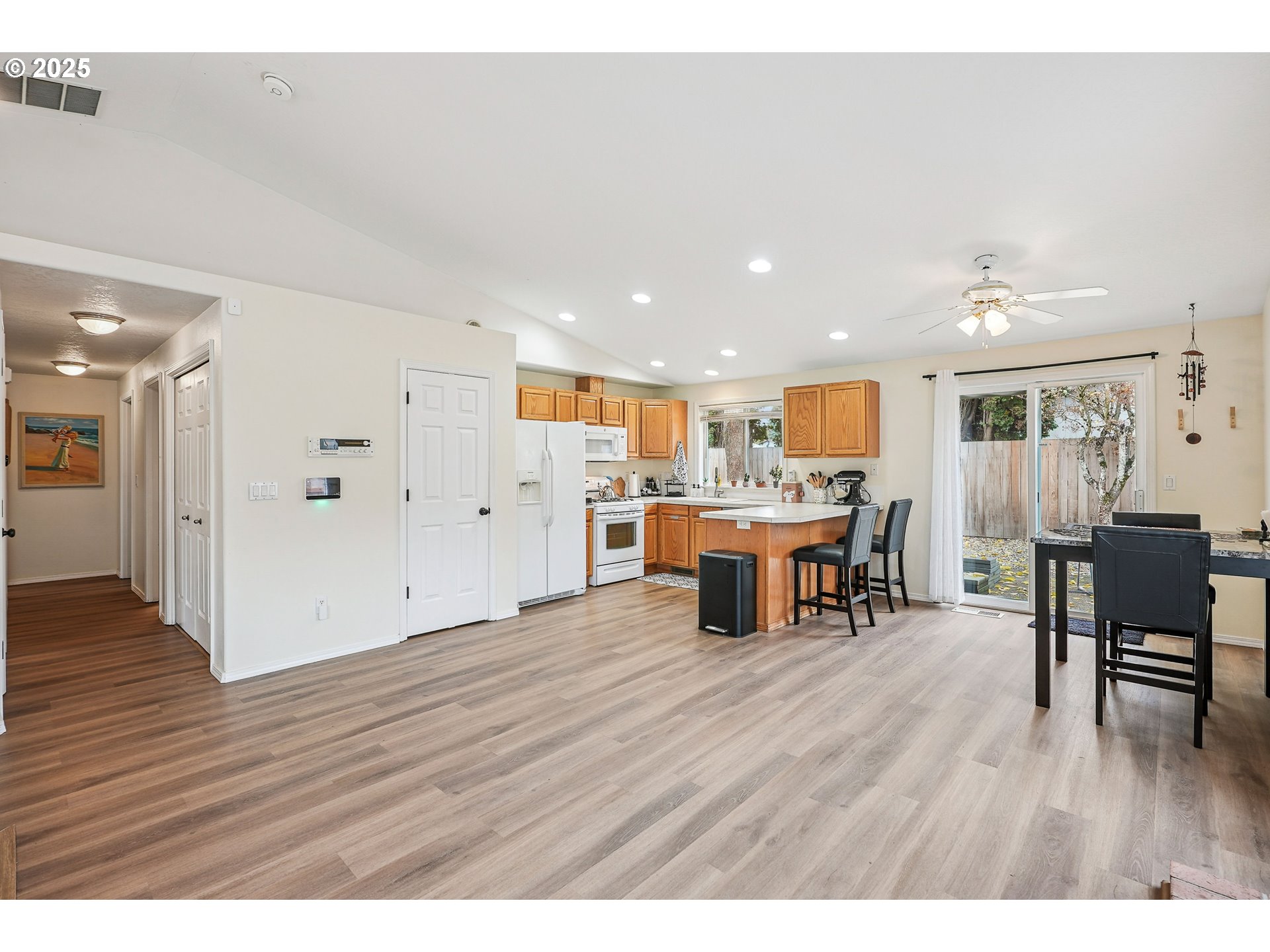 591 Southwest Filbert Street McMinnville, OR 97128 - Photo 10 of 34 a living room with furniture and kitchen view with wooden floor