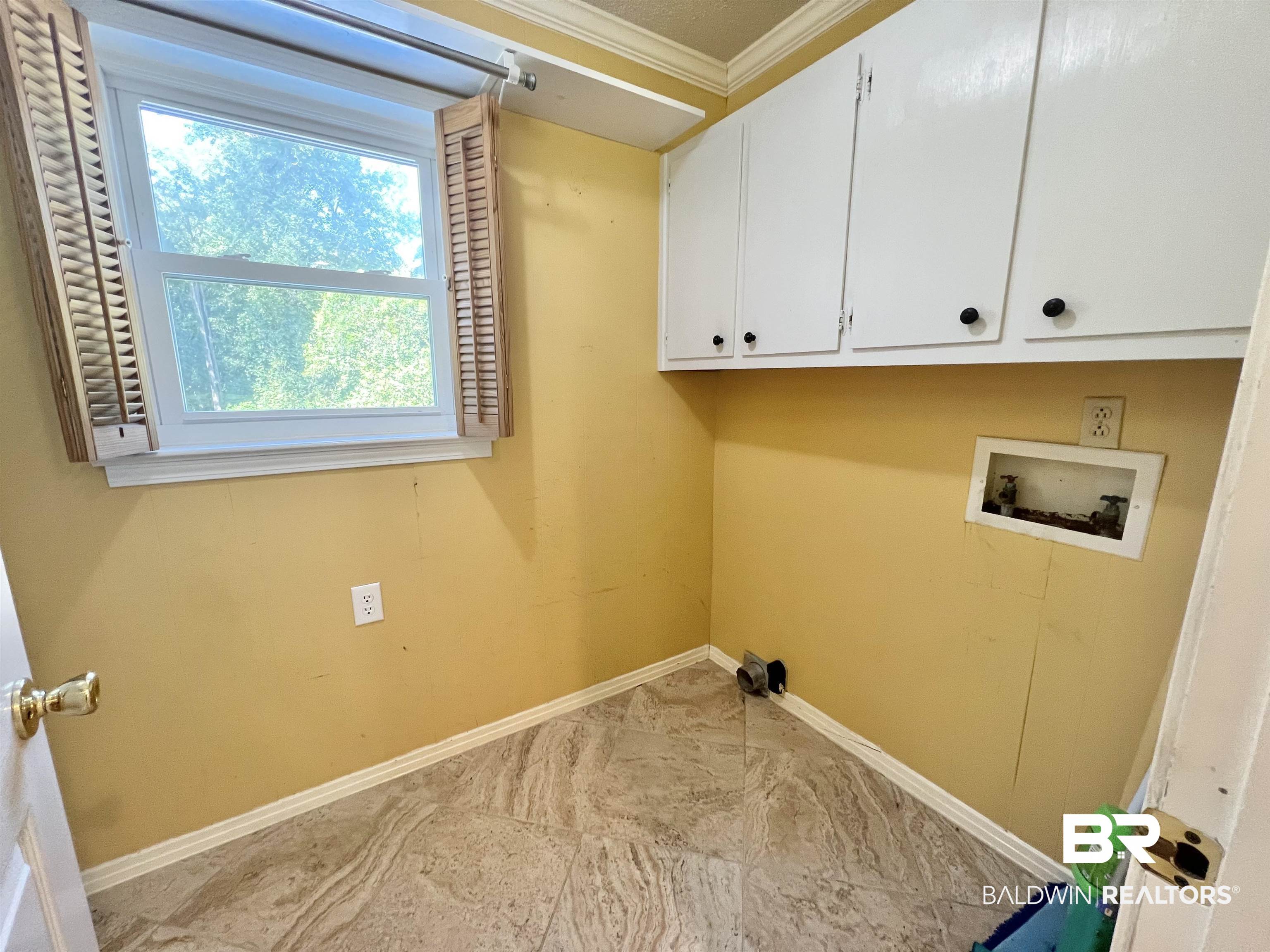 2691 Appleton Road Brewton, AL 36426 - Photo 19 of 60 Washroom featuring crown molding, hookup for a washing machine, and cabinet space