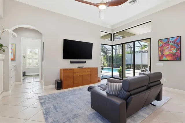 a living room with furniture and a dining table
