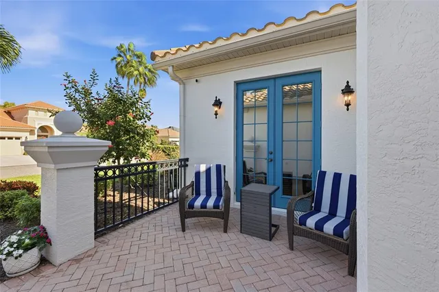 a view of a patio with couches table and chairs and potted plants