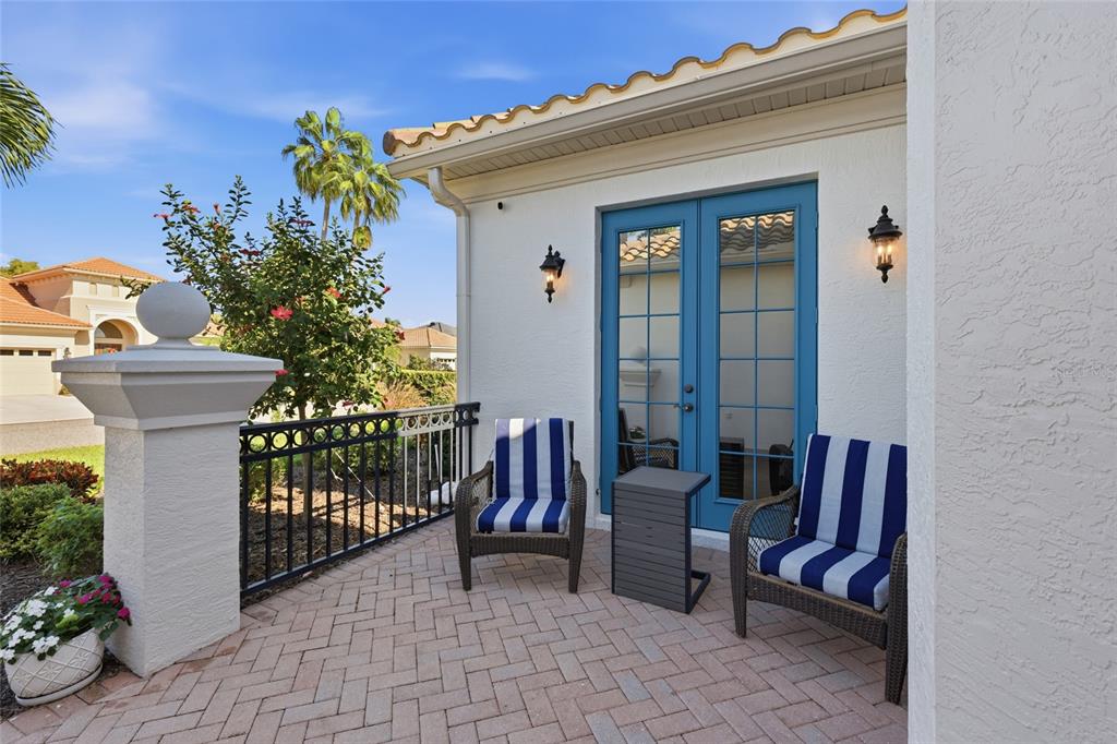 7060 Whitemarsh Circle Lakewood Ranch, FL 34202 - Photo 3 of 56 a view of a patio with couches table and chairs and potted plants