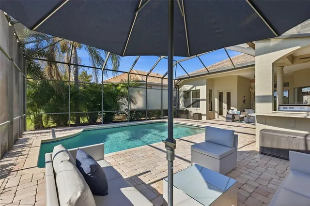 a view of a swimming pool with a yard