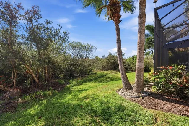 a view of sign board with flower around