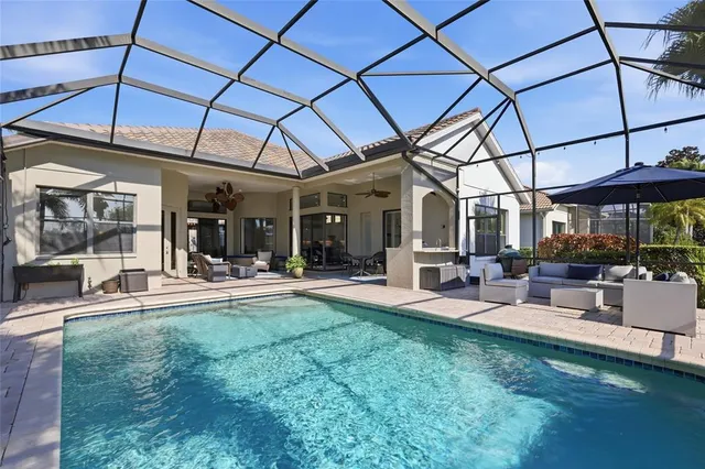 a view of a backyard with sitting area