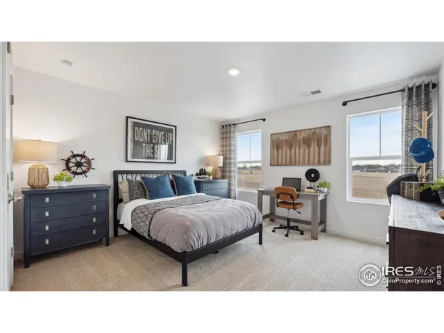 a living room with furniture and a dresser