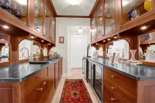 a kitchen with stainless steel appliances granite countertop a sink and cabinets