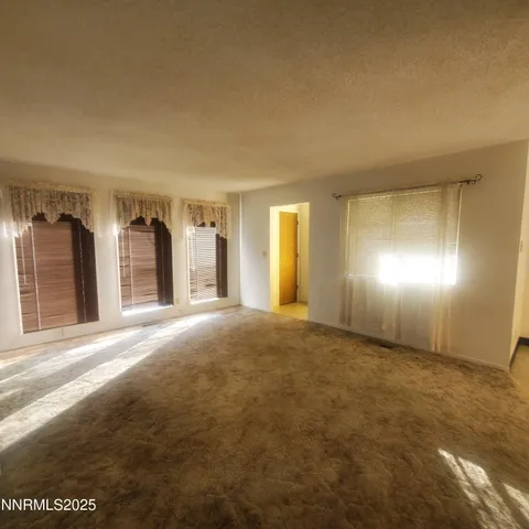 a view of an empty room and window