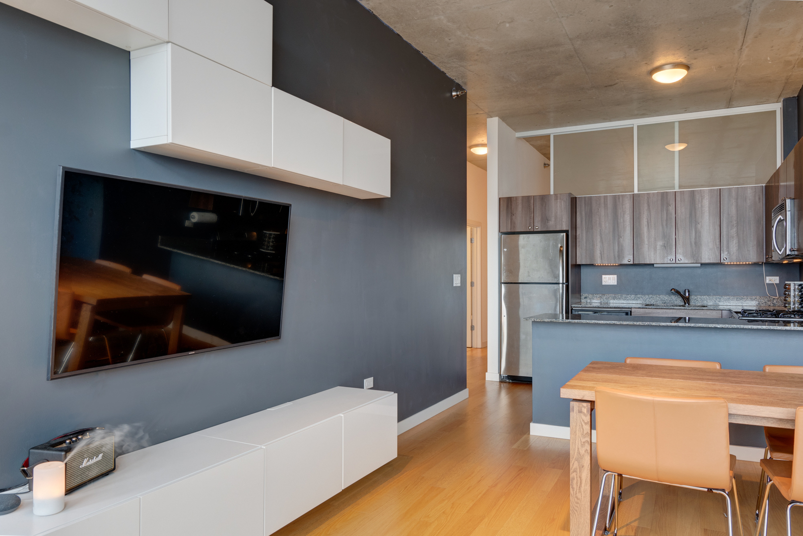 235 West Van Buren Street, Unit 3011 Chicago, IL 60607 - Photo 14 of 30 a kitchen with stainless steel appliances a stove a microwave and cabinets