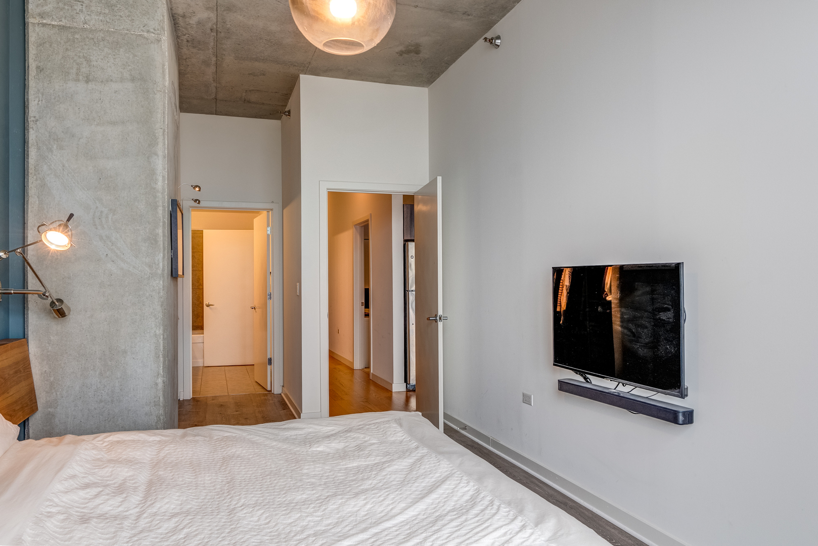 235 West Van Buren Street, Unit 3011 Chicago, IL 60607 - Photo 21 of 30 a bedroom with a bed and a window