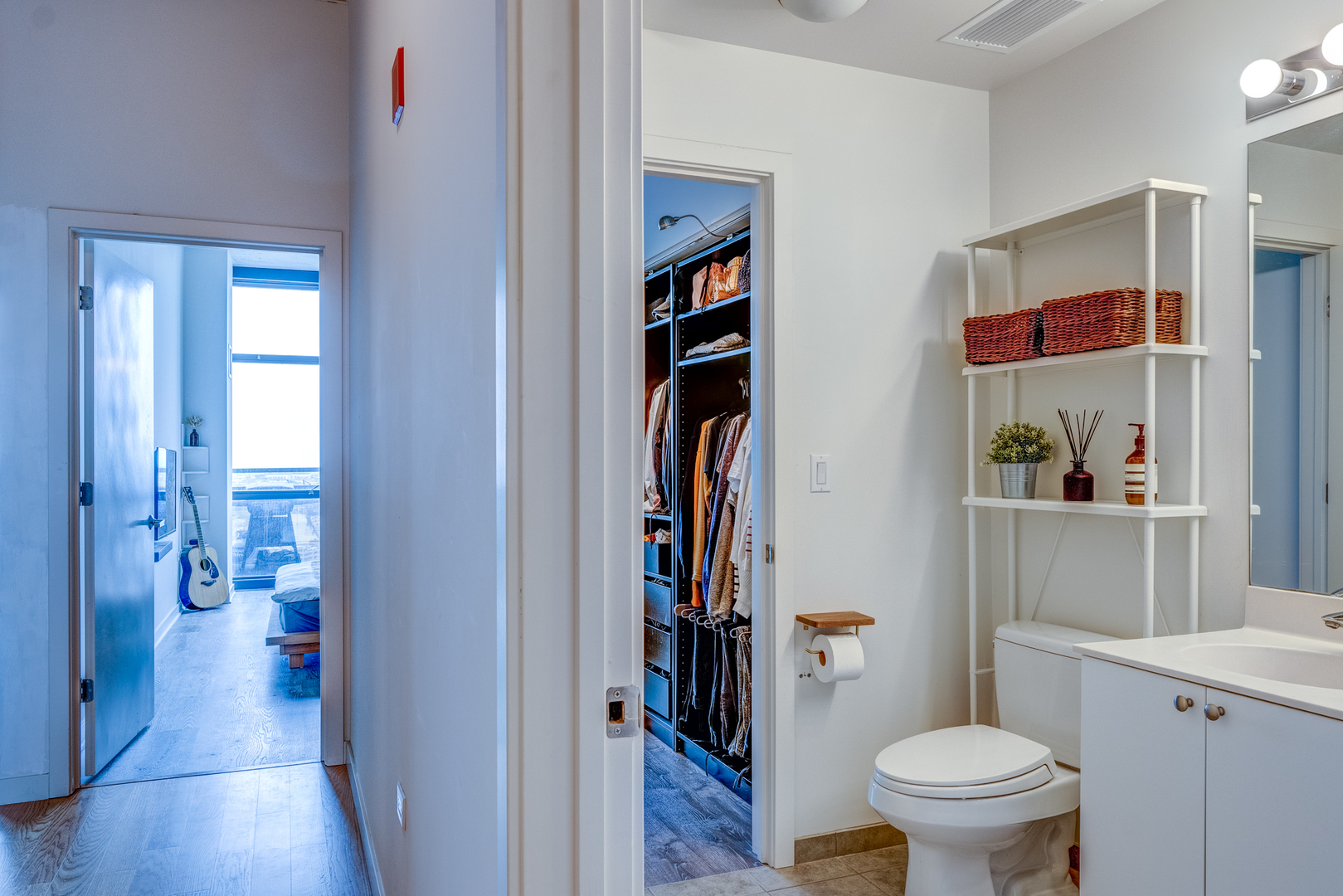 235 West Van Buren Street, Unit 3011 Chicago, IL 60607 - Photo 29 of 30 a bathroom with a toilet and a shower curtain