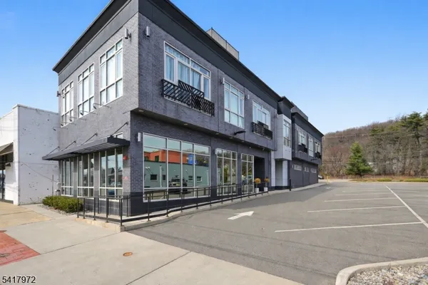 a view of a building with a street