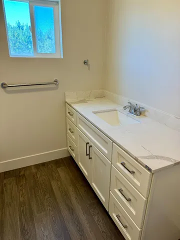 a view of a room with wooden floor and closet