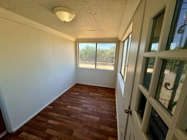 a view of livingroom with hardwood floor and window