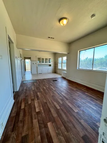 a kitchen with stainless steel appliances a refrigerator sink and cabinets