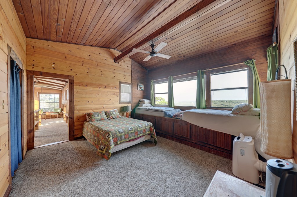 134 White Pearl Road Hunt, TX 78024 - Photo 14 of 40 a spacious bedroom with two beds and window