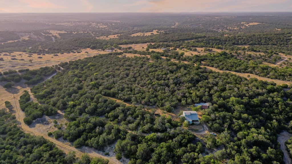 134 White Pearl Road Hunt, TX 78024 - Photo 26 of 40 an aerial view of house with yard and mountain view in back