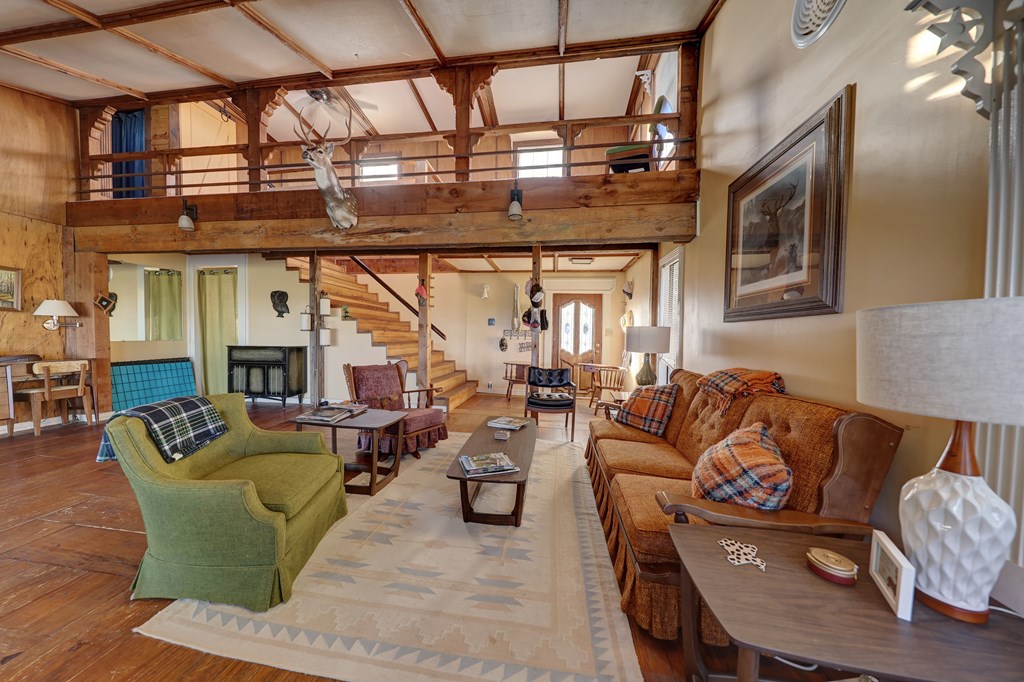 134 White Pearl Road Hunt, TX 78024 - Photo 9 of 40 a living room with fireplace furniture and a chandelier