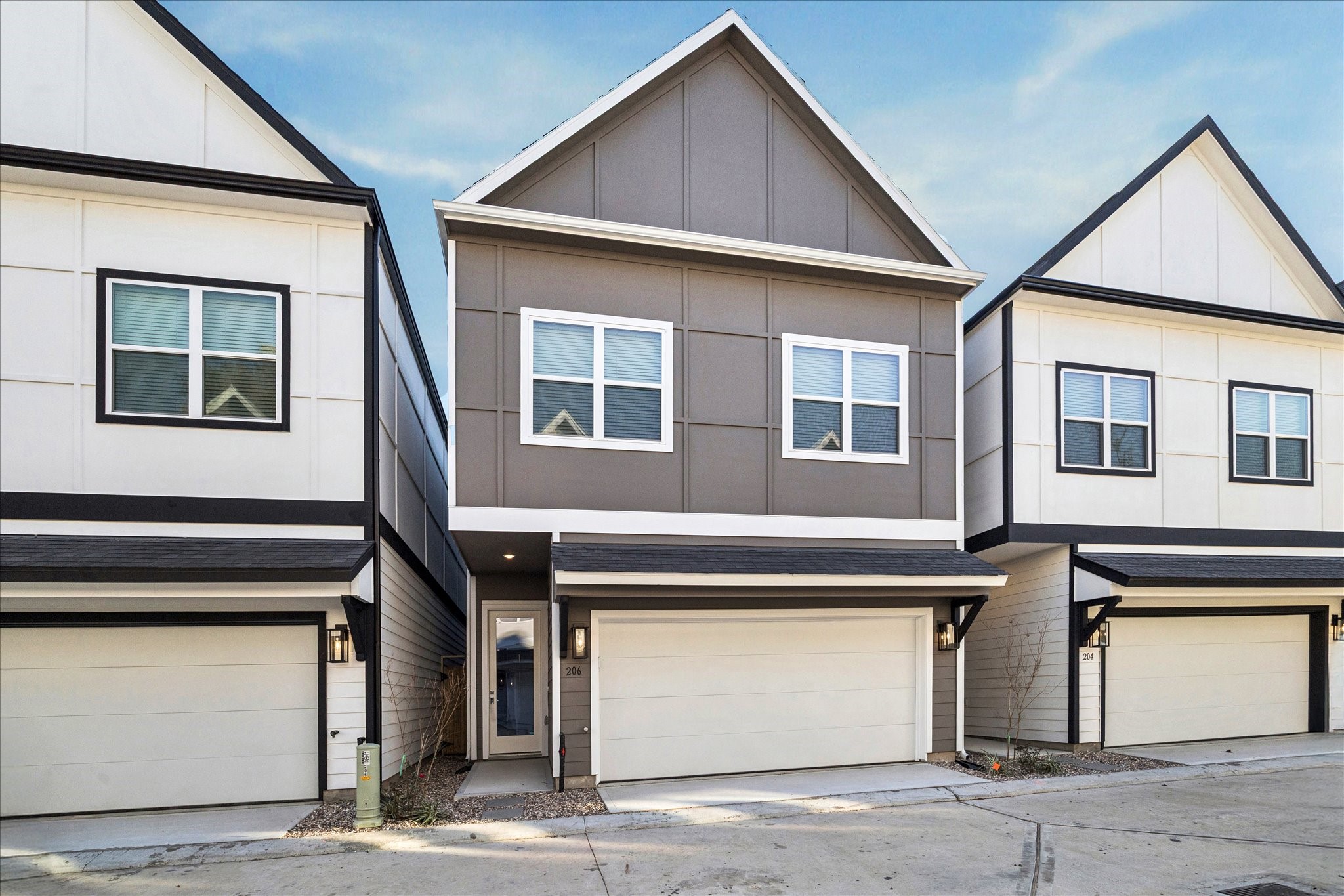 a front view of a house with a garage