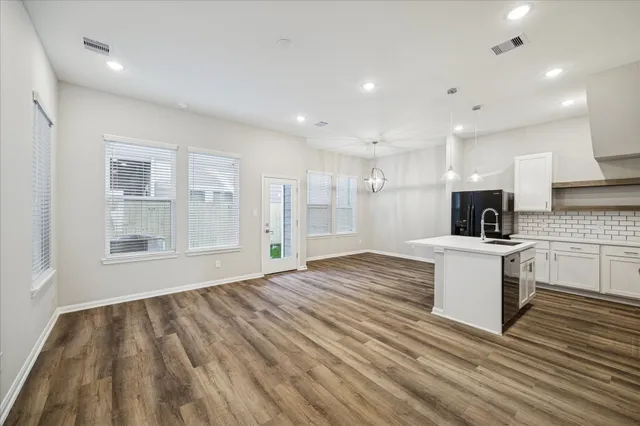 a view of kitchen and wooden floor