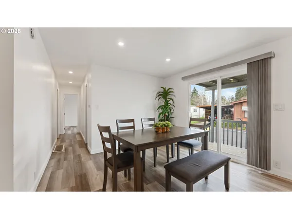 a kitchen with a table and chairs in it