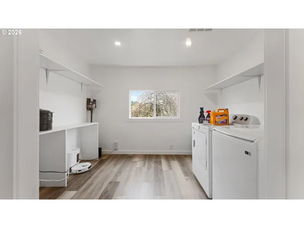 a kitchen with a refrigerator and window