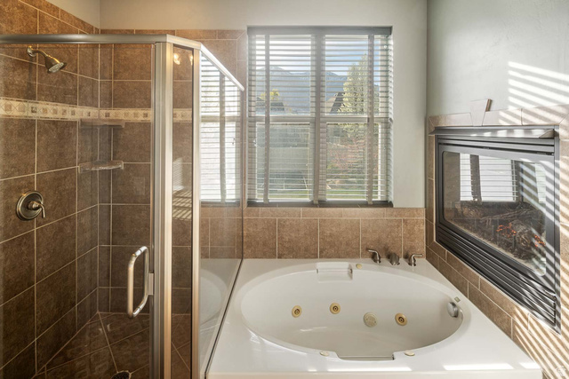 1997 West Cres Drive Mapleton, UT 84664 - Photo 17 of 35 Full bath featuring a stall shower and a whirlpool tub