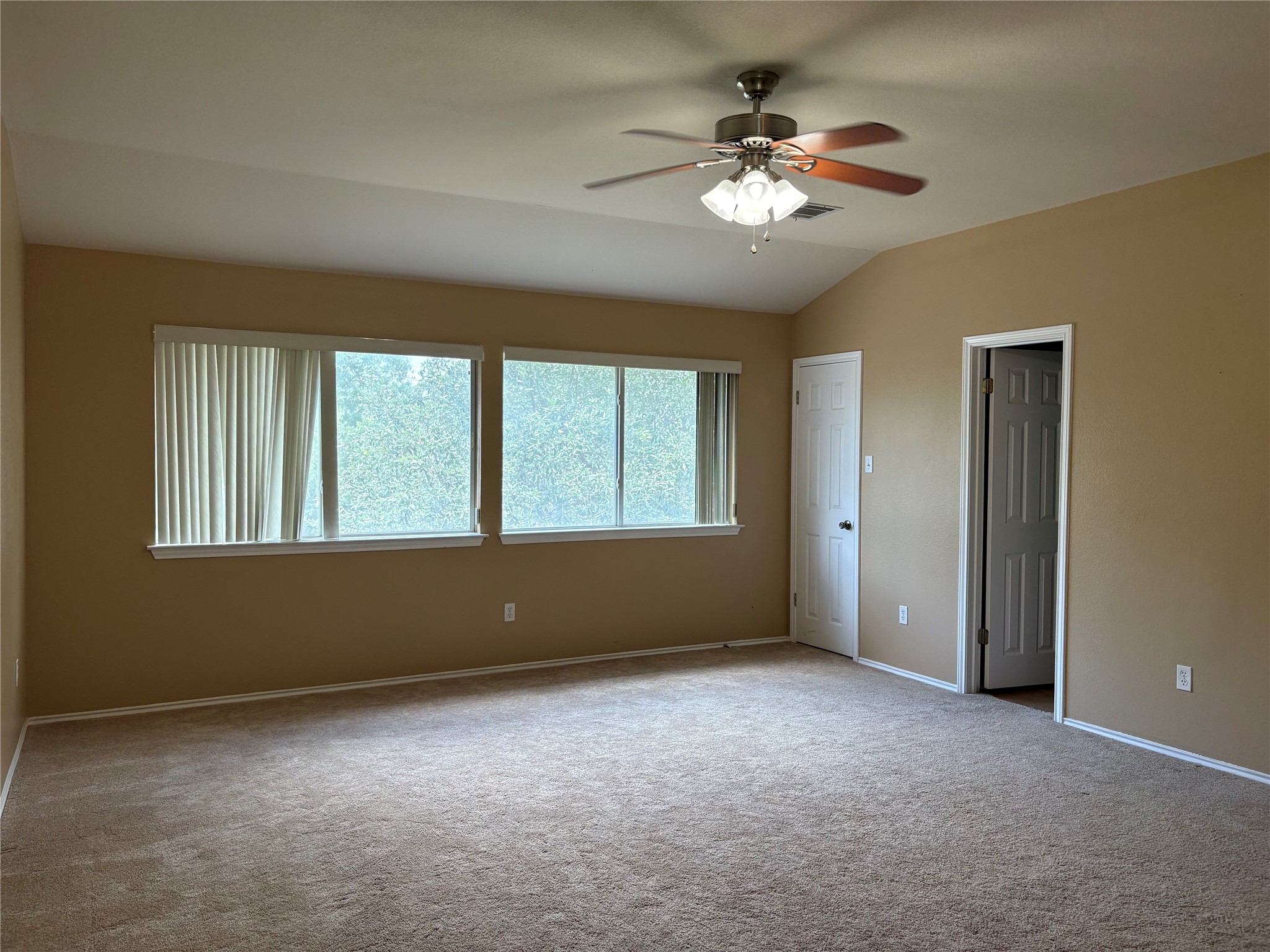 8103 Ephraim Road Austin, TX 78717 - Photo 23 of 35 A spacious bedroom features plush carpeting and a modern ceiling fan, offering comfortable living.