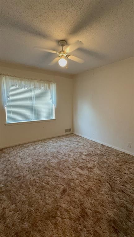 1387 Hickory Street Rhome, TX 76078 - Photo 14 of 36 Window with blinds and ceiling fan. Large closet.