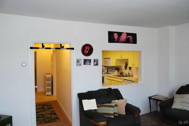 606 West Broad Street, Unit F Bethlehem, PA 18018 - Photo 7 of 16 The large, sun-lit living room adjoins the kitchen