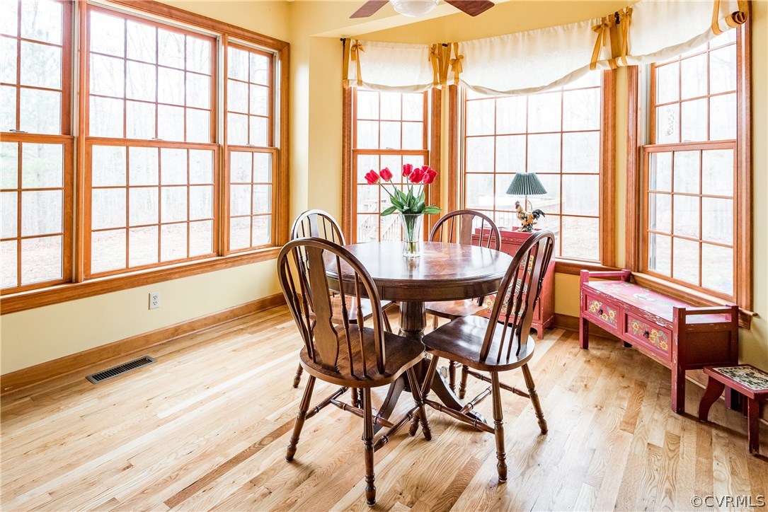 11300 Taylor Road Chesterfield, VA 23838 - Photo 11 of 39 a view of a dining room with furniture a chandelier and wooden floor
