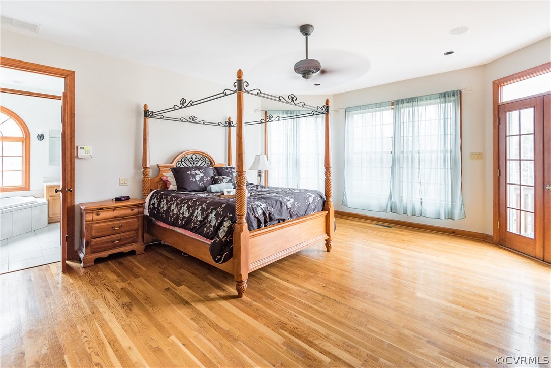11300 Taylor Road Chesterfield, VA 23838 - Photo 18 of 39 a bedroom with a bed and large windows