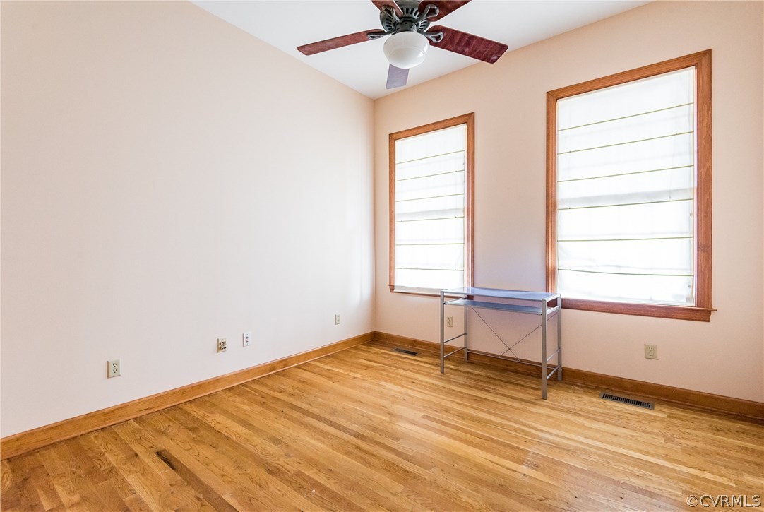 11300 Taylor Road Chesterfield, VA 23838 - Photo 21 of 39 an empty room with a window and wooden floor