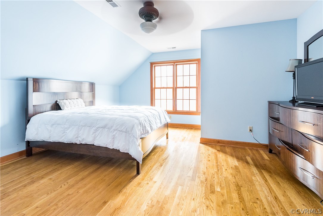 11300 Taylor Road Chesterfield, VA 23838 - Photo 24 of 39 a bedroom with a bed and a flat tv screen on dresser