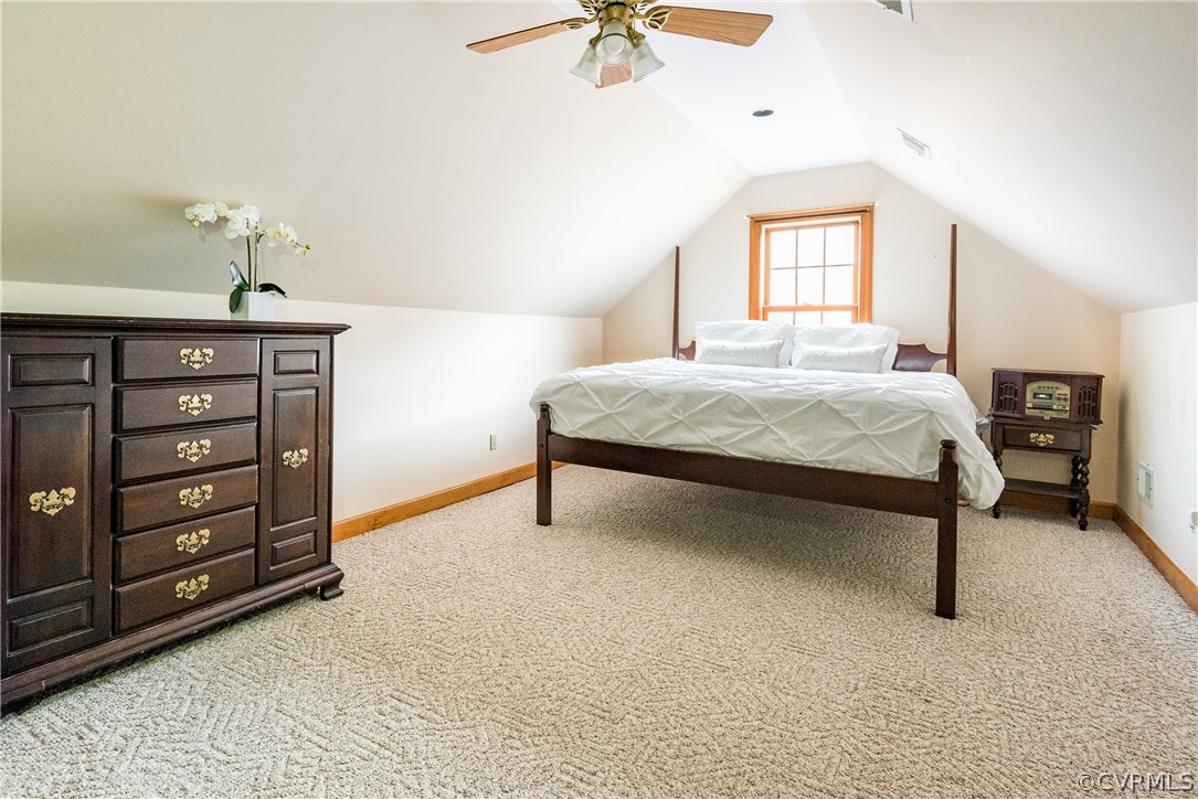 11300 Taylor Road Chesterfield, VA 23838 - Photo 26 of 39 a bedroom with a bed a chandelier and a dresser