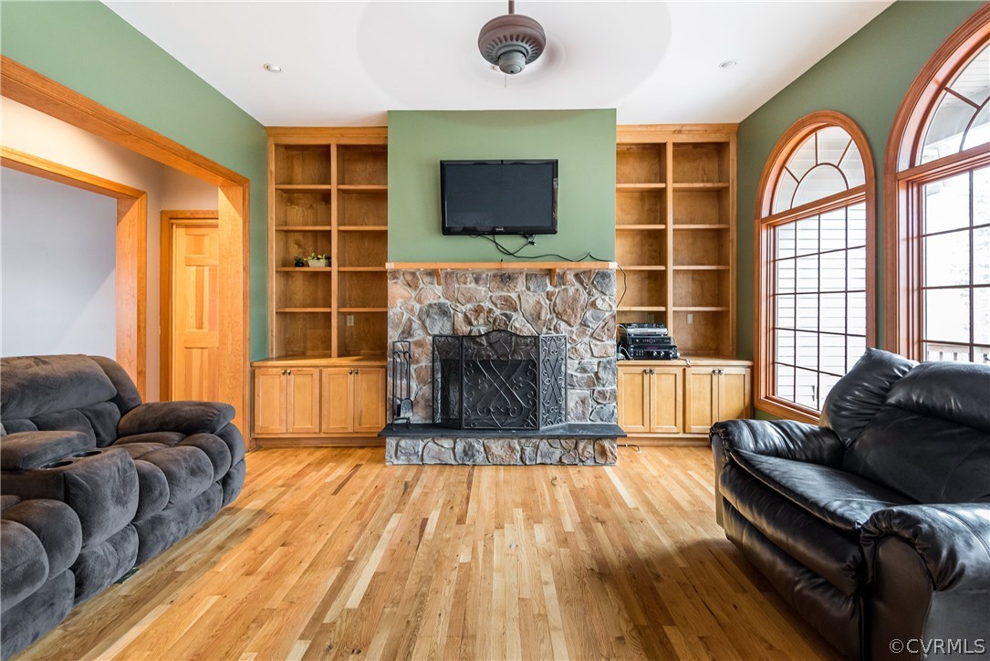 11300 Taylor Road Chesterfield, VA 23838 - Photo 3 of 39 a living room with furniture a flat screen tv and a fireplace